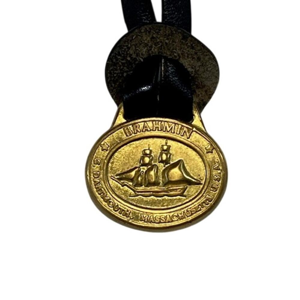 Brahmin vintage classic gold-tone logo medallion charm.